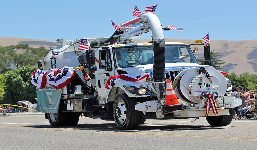 Service truck decorated in US flags for 4th of July parade